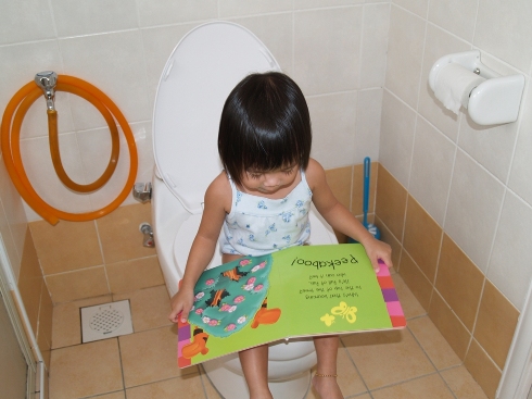 Zara using the toilet